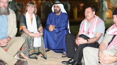 Sheikh Mohammed bin Rashid, Prime Minister and Ruler of Dubai, and Isobel Abulhoul, founder of the Emirates Airline Festival of Literature, with authors at the event in 2013. Photo: Emirates Airline Festival of Literature