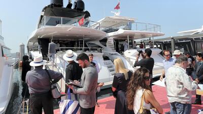 Visitors and media personals at the Dubai International Boat Show held in Dubai. Pawan Singh / The National
