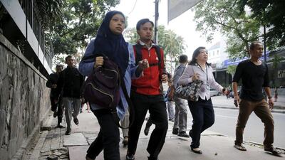 Tri Seranto, a bank security guard, said he saw at least five attackers, including three who triggered explosions at the Starbucks. It was not immediately clear if they exploded bombs or grenades. Beawiharta / Reuters