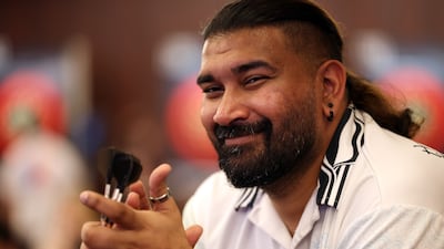 Dubai resident Nitin Kumar became the first Indian to win a match at the World Darts Championship. All images by Chris Whiteoak / The National