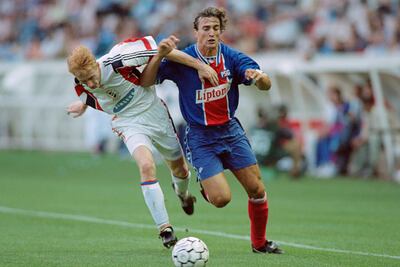 David Ginola, right, during his playing days with Paris Saint-Germain. Gerard Julien / AFP