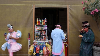 Clowns stop for a snack while celebrating Peruvian Clown Day in Lima. Reuters