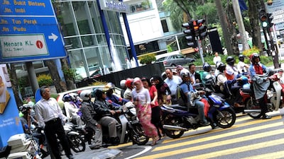 DHL is aiming to reduce logistics-related emissions down to zero by 2050. It's piloting its efforts in Malaysia. AFP