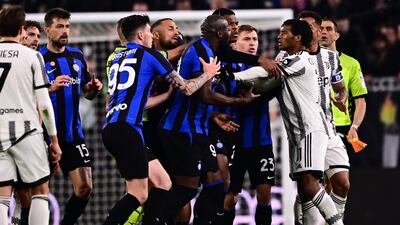 Inter Milan’s Romelu Lukaku, centre, argues with Juventus’ Juan Cuadrado during the Coppa Italia semi-final first leg at the Allianz Stadium in Turin on Tuesday, April 4, 2023. AFP