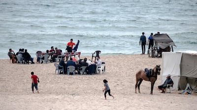 Palestinians gather for iftar along the shore of Gaza City. AFP