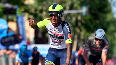 Eritrea's Biniam Girmay celebrates as he crosses the finish line of the 10th stage of the Giro D'Italia cycling race from Pescara to Jesi, Italy, Tuesday, May 17, 2022. (Massimo Paolone / LaPresse via AP)
