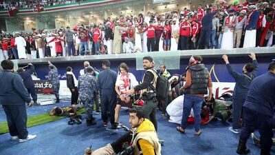 Wounded fans await treatment after a glass barrier broke at the end of the Gulf Cup of Nations 2017 final football match between Oman and the UAE at the Sheikh Jaber al-Ahmad Stadium in Kuwait City on January 5, 2018. Yasser Al-Zayyat / AFP