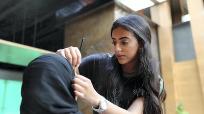 Hams Saleh, combines her social media presence with life as a certified make up artist. Pawan Singh / The National