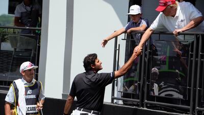Eugenio Chacarra shakes hands with Mr Trump during the second round of the LIV Golf at Trump National Golf Club. AP
