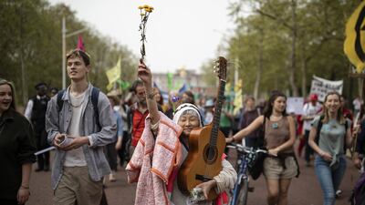 Extinction Rebellion campaigners marching to Parliament Square in London to highlight the ongoing ecological crisis. Dan Kitwood / Getty Images