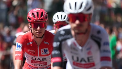 UAE Team Emirates-XRG rider Tadej Pogacar wearing the leader's red jersey at La Vuelta. Reuters
