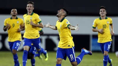 Boschilia, centre, scored twice for Brazil against Honduras on Wednesday night. Karim Sahib / AFP