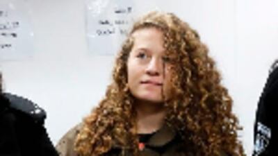 Ahed Tamimi, 16, at her hearing in the military court at Ofer military prison in the West Bank village of Betunia on January 1, 2018. Israeli authorities are seeking 12 charges against the teenager after a video of her slapping and kicking two Israeli soldiers in the West Bank went viral. Ahmad Gharabli / AFP