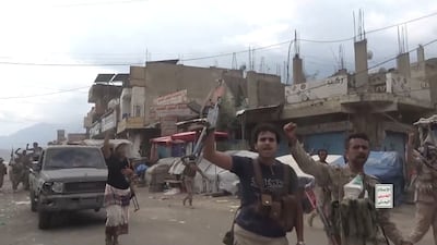 Houthi fighters march on the streets of Taiz province. Reuters
