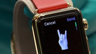 A sales assistant shows an Apple Watch. Chaiwat Subprasom / Reuters