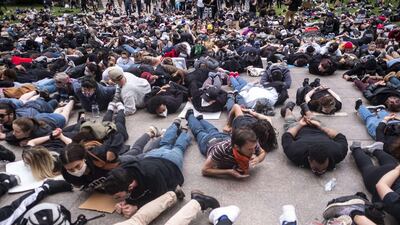 Protesters perform a mass 'die-in' in front of the Ohio Statehouse at the exact time George Floyd died on May 25 in Minneapolis police custody in Columbus, Ohio. Getty Images