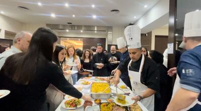 Volunteers prepare a fusion of dishes from the Gulf and Argentina. Aveen Karim / The National