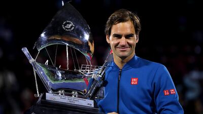 Roger Federer poses with the 100th trophy of his career after defeating Stefanos Tsitsipas in the Dubai Duty Free Tennis Championships final on Saturday. Getty