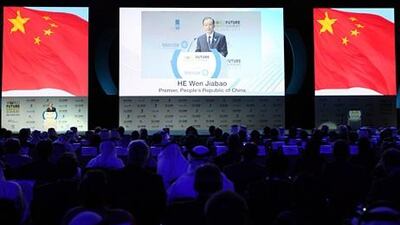 epa03062021 Wen Jiabao (L), Premier and Party secretary of the State Council of the People's Republic of China gives a speech during the opening ceremony of the World Future Energy Summit (WFES) 2012 in Abu Dhabi, United Arab Emirates, 16 January 2012. Participants from nearly 140 countries are attending the 5th edition of the WFES which take place from 16-19 January 2012, the event is expected to attract around 26,000 people, including 3,000 delegates and 650 companies, officials said. EPA/ALI HAIDER *** Local Caption *** 03062021.jpg