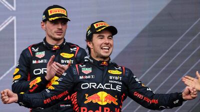 Red Bull's Sergio Perez celebrates his win with second-placed Max Verstappen, also of Red Bull. AFP