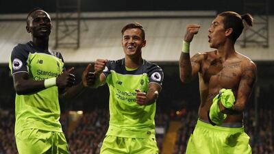 Liverpool's Roberto Firmino celebrates scoring their fourth goal with Philippe Coutinho and Sadio Mane. John Sibley / Action Images / Reuters / October 29, 2016