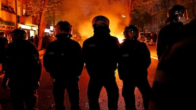Police stand in front of a fire during the annual leftist protest march on May Day amid the third wave of the coronavirus pandemic on Saturday in Berlin, Germany. Getty Images