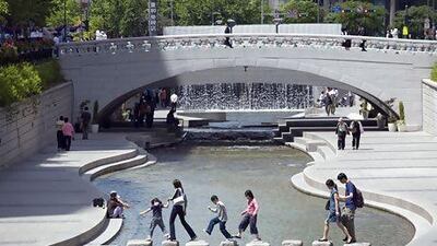 Cheonggyecheon, a small stream that flows through Seoul, was restored as South Koreans began to demand a cleaner living environment. Paul Souders / The Image Bank / Getty Images