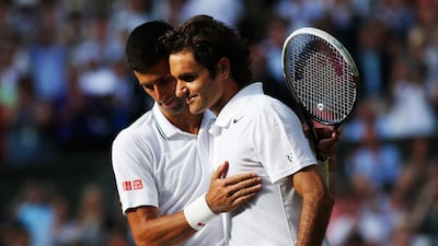 Novak Djokovic and Roger Federer shown together after Djokovic defeated Federer in the final of last year's Wimbledon tournament. Getty Images Photo / July 6, 2014
