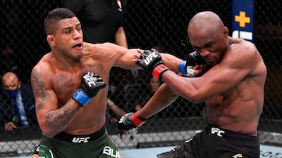 Gilbert Burns, left, of Brazil punches Kamaru Usman of Nigeria in their UFC welterweight championship fight during the UFC 258 event at UFC APEX in Las Vegas, Nevada. Jeff Bottari / Zuffa LLC / UFC