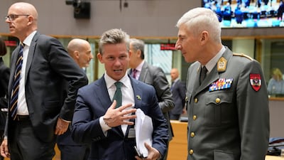 Sweden's Defense Minister Pal Jonson, centre, said that his country joining Nato would boost the stability and security of the alliance. AP