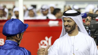 Saeed bin Suroor shakes hand with Christophe Soumillon after winning the Dubai World Cup. Chris Whiteoak / The National