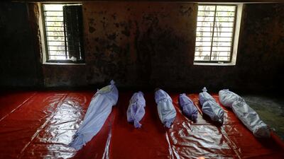Bodies of Rohingya refugees, who died when their boat capsized while fleeing Myanmar, are placed in a local madrasa where victims' bodies were brought to, in Shah Porir Dwip, in Teknaf, near Cox's Bazar in Bangladesh. Damir Sagolj / Reuters