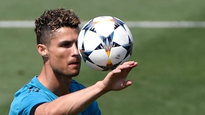 Real Madrid forward Cristiano Ronaldo attends a training session. Gabriel Bouys / AFP