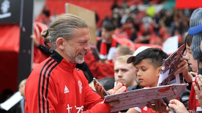 Manchester United's Jesper Blomqvist signs autographs. AFP