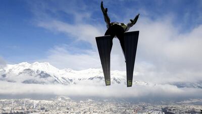 Peter Prevz from Slovenia soars through the air during a trial jump at the four-hills ski jumping tournament in Innsbruck on Saturday. Dominic Ebenbichler / Reuters