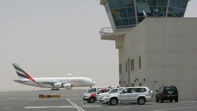 DUBAI - JULY 1,2010 - Emirates airplane taxi on the run way of the Dubai World Central - Al Maktoum International airport. ( Paulo Vecina/The National )