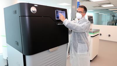 Dante chief executive Andrea Riposati showing how the sequencer machine works at Dante Labs, Silicon Oasis in Dubai.