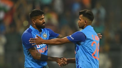 India captain Hardik Pandya, left, congratulates debutant Shivam Mavi after he took the wicket of Sri Lanka's Maheesh Theekshana during the first T20 in Mumbai. AFP