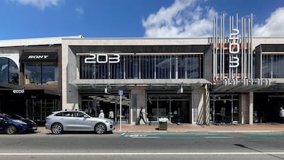 The same location in Redcliffs suburb of Christchurch nearly 10 years later where new retail buildings occupy the site on February 17, 2021. AFP