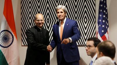 Anil Madhav Dave, pictured with former US secretary of State John Kerry on October 14, 2016. James Akena / Reuters, file