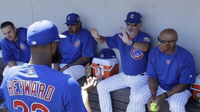 Chicago Cubs manager Joe Maddon gestures as he talks to Jason Heyward during a spring training game last week. Jeff Chiu / AP / March 25, 2016