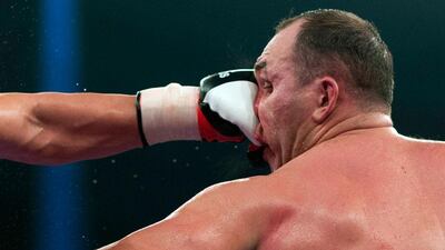 EBU European heavyweight champion Kubrat Pulev of Bulgaria lands a punch on his opponent Alexander Ustinov of Belarus during the fight for Pulev's heavyweight title and IBF eliminator in Hamburg, Germany. Gero Breloer / AP Photo