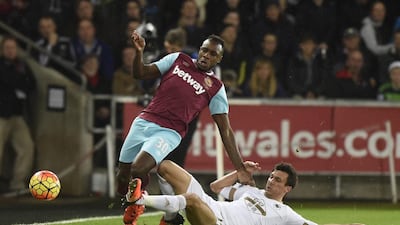 West Ham's Michail Antonio and Swansea's Jack Cork in action. Rebecca Naden / Reuters