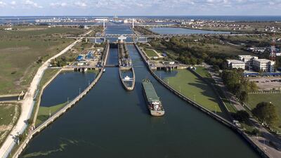 A barge floats to a fairway from a Danube Black Sea Canal to Constanta trade port in Agigea village, Romania. Today the channel is a gateway to world markets, transforming one of the European Union’s poorest members into its biggest exporter of wheat alongside France. All pictures: Bloomberg