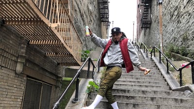 Jay Garcia, a radio host from Queens, dances down the 'Joker' steps in the Bronx borough of New York, US, on Wednesday, October 16, 2019. Reuters