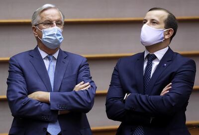 European Commission's Head of Task Force for Relations with the UK Michel Barnier and EU Environment, Oceans and Fisheries Commissioner Virginijus Sinkevicius chat in the hemicycle ahead of EC President Ursula Von Der Leyen's first State of the Union speech during a plenary session of European Parliament in Brussels. Reuters