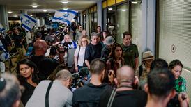 Shaken passengers leave the terminal at Ben Gurion Airport, Israel having been diverted after the mid-air ordeal. Getty Images