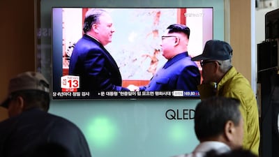 South Koreans watch on a screen reporting the US Secretary of State Mike Pompeo visit to North Korea at the Seoul Railway Station in Seoul. Chung Sung-Jun / Getty Images