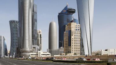 Above, high rise buildings at Doha's west bay. The country's planned 'Wall Street' will cover an area of up to 300,000 square metres. Valdrin Xhemaj / EPA