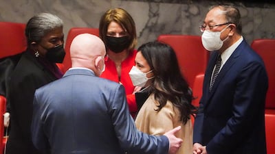 Ms Thomas-Greenfield, Mr Zhang, Norwegian ambassador Mona Juul, in red, UAE ambassador Lana Nusseibeh and Mr Nebenzya, speak at the meeting. Reuters